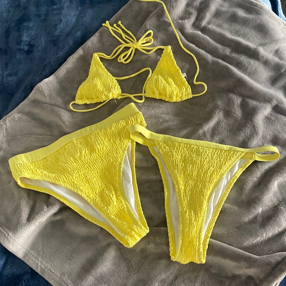 Never worn yellow bathing suit! Comes with two different bottom styles.